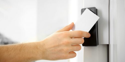 Security,Alarm,Keypad,With,Male,Hand,And,Card,,Closeup